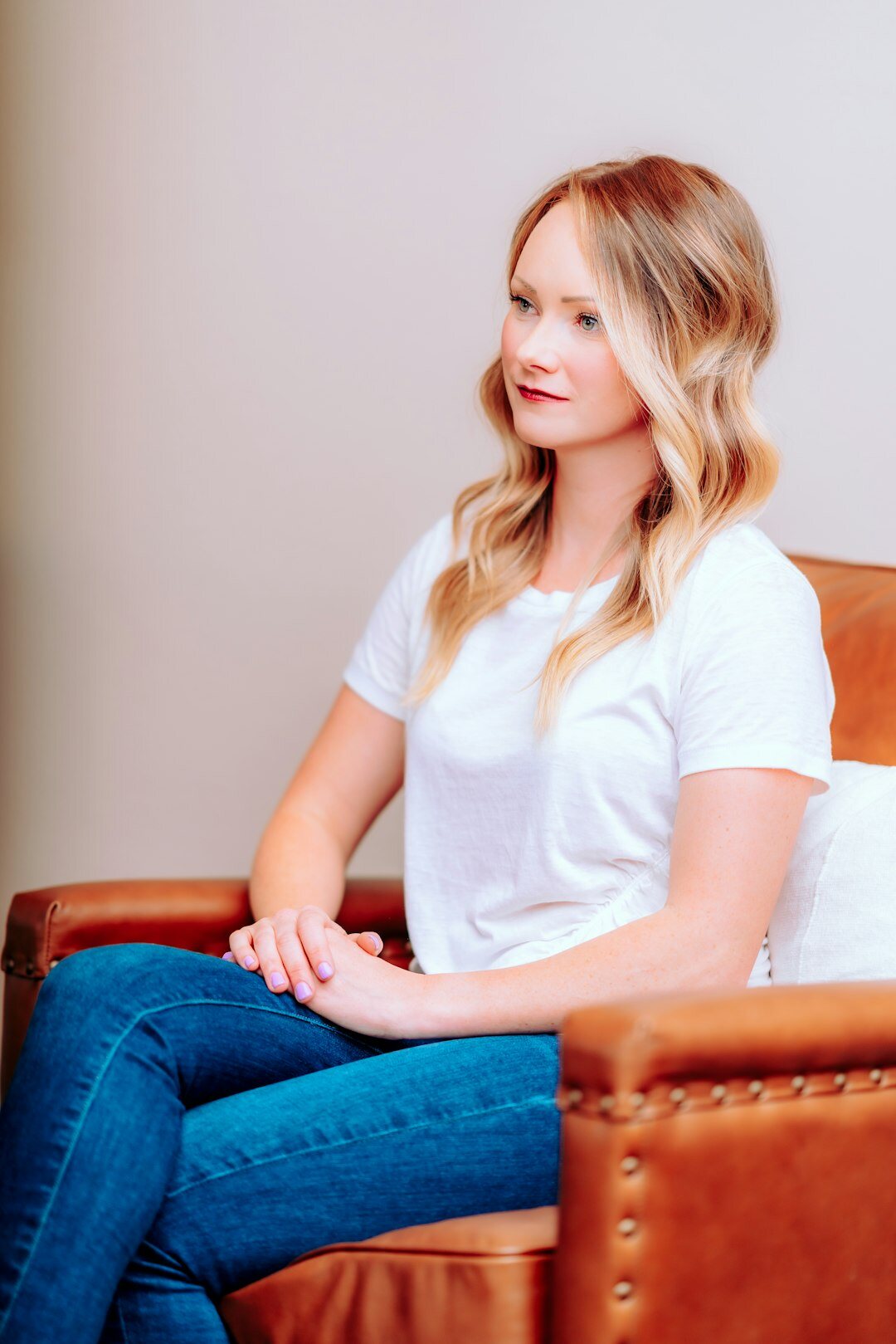 Portrait of a Belgian female podcast host smiling